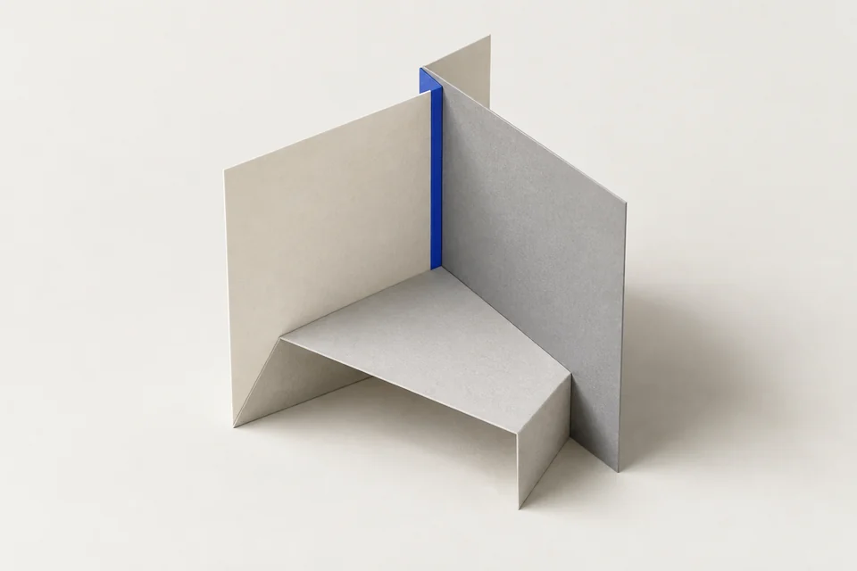 Three folded paper planes joined into one open structure.